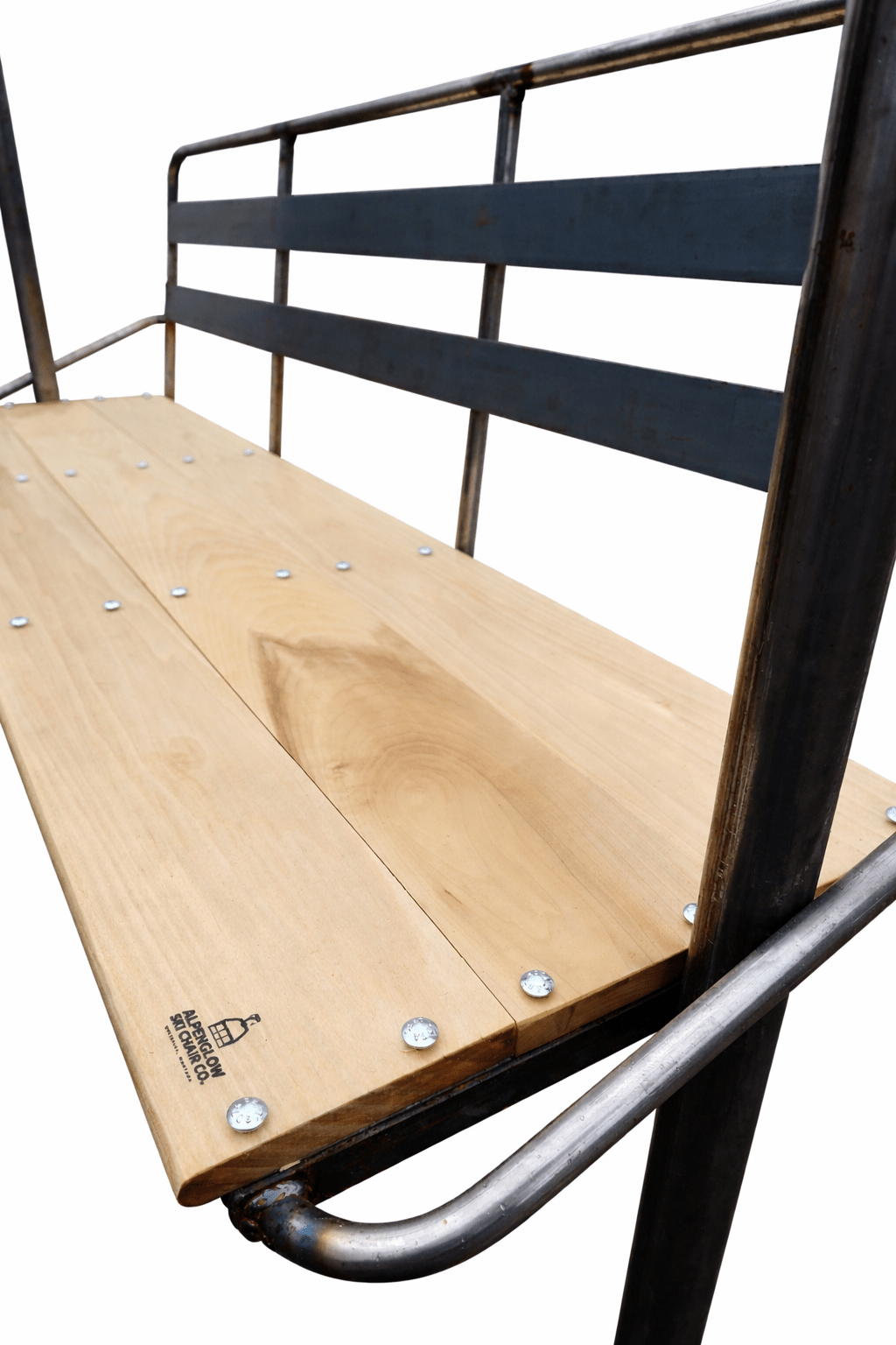 Close-up of wood seat and metal frame on custom ski chair bench by Alpenglow Ski Chair Co